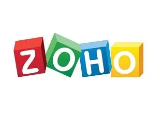 ZOHO logo displayed in red, green, blue, and yellow 3D blocks on a white background.
