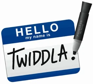 Name tag labeled “HELLO, my name is TWIDDLA” sits beside a black marker on a white background.
