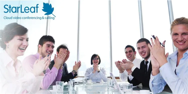 Business team applauds and smiles around a conference table beneath a StarLeaf Cloud video conferencing logo.