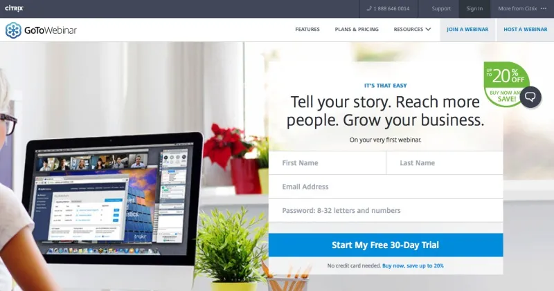 Laptop displays a webinar interface beside a signup form, with a partially visible person, plants, and bright office furnishings.