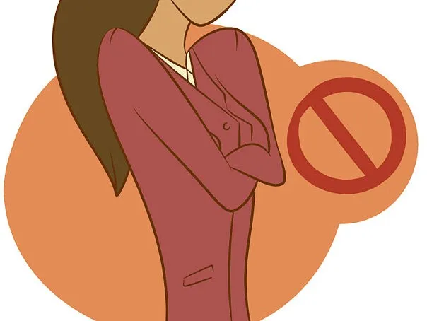 Woman in a burgundy suit crosses her arms beside a red prohibition symbol on an orange background.
