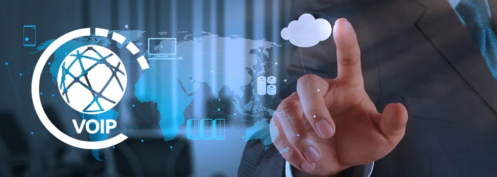 Businessperson touches a digital interface beside a globe labeled “VOIP,” world map, cloud, and blue network graphics.