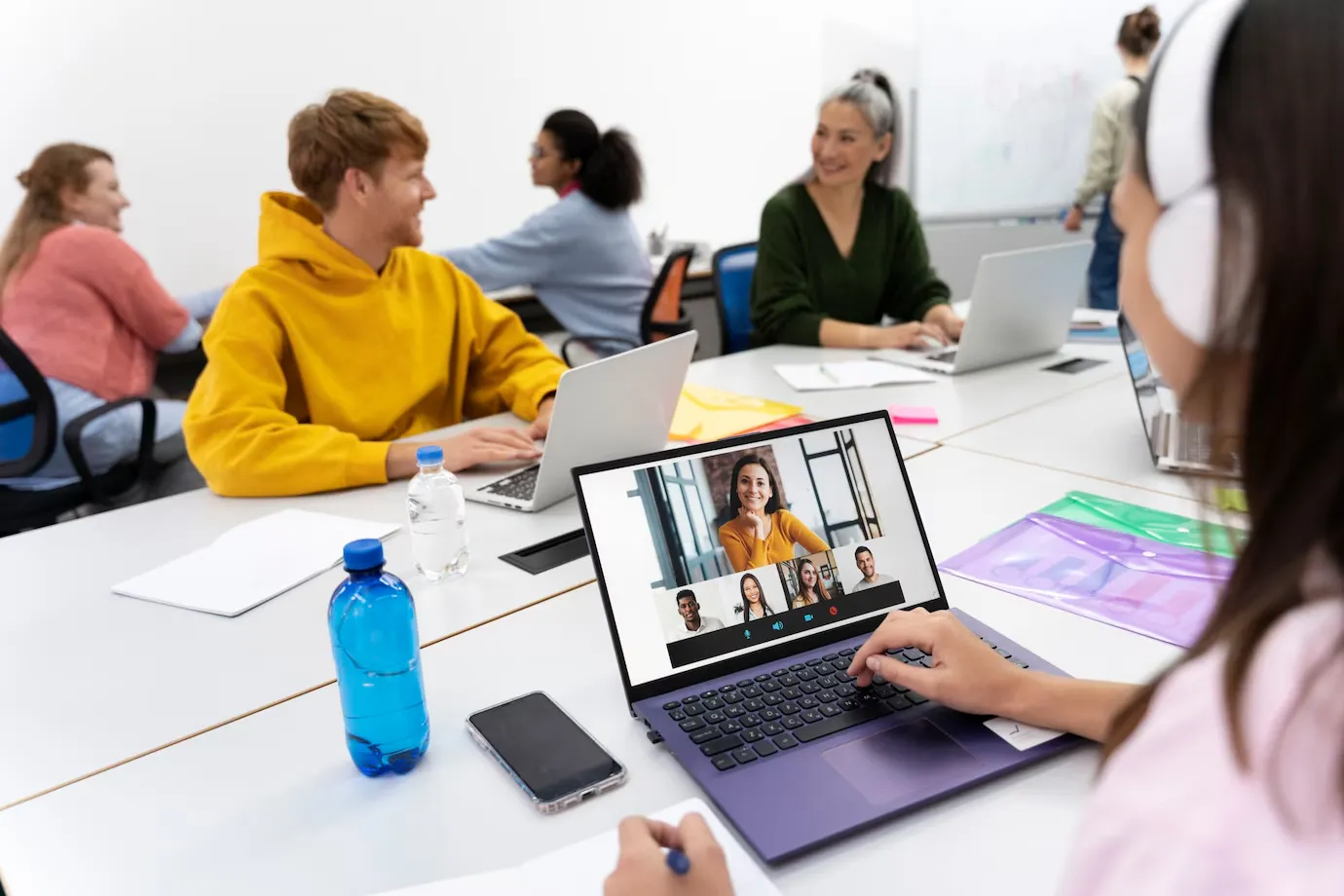 Virtual classroom meeting with collaborative learning and laptops