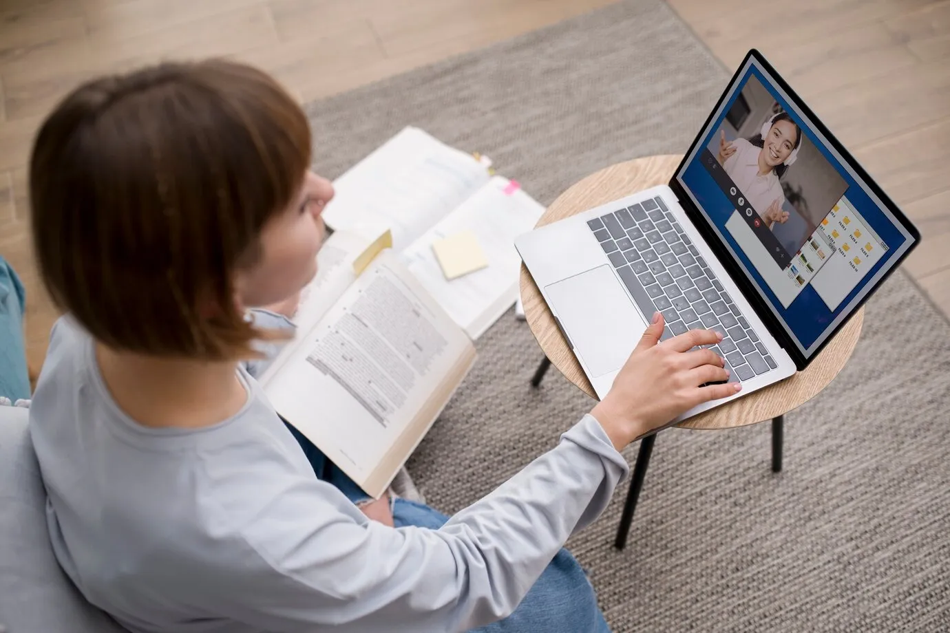 Student using Dell laptop for remote learning video call