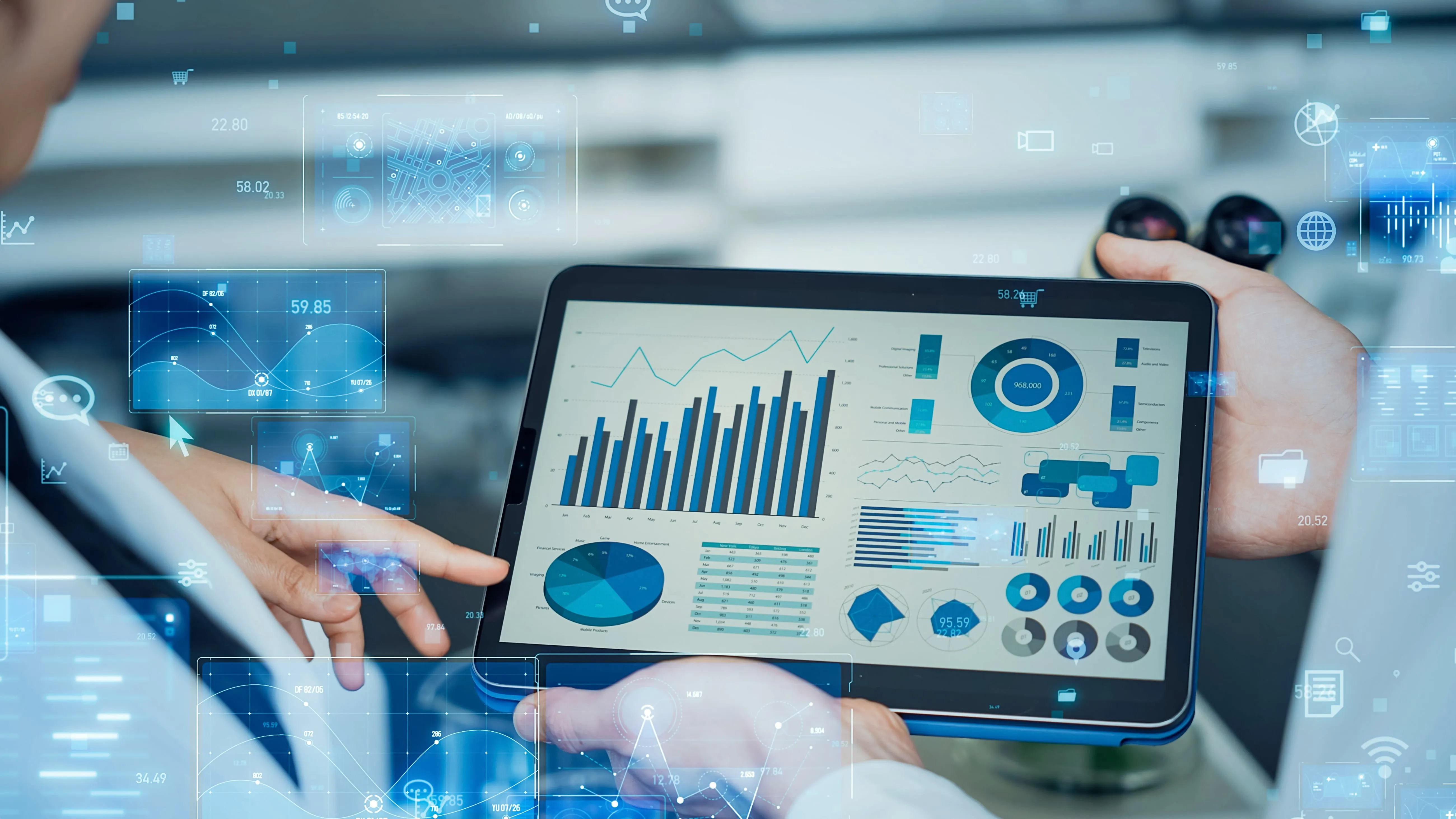 Business analyst reviewing interactive holographic data on tablet